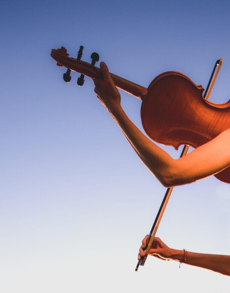 Female violinist portrait photoshoot in Durres Albania by professional photographer