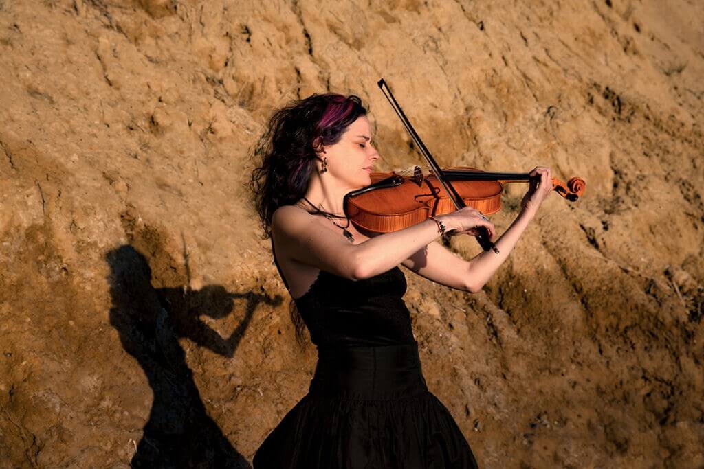 Female violinist portrait photoshoot in Durres Albania by professional photographer